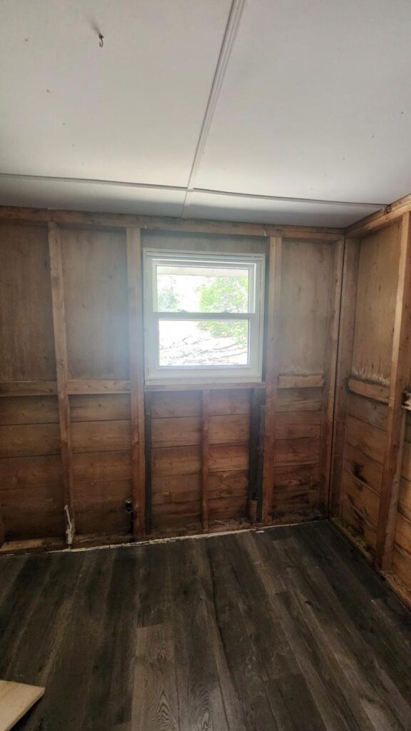 Basement room stripped back to wall studs ahead of renovation