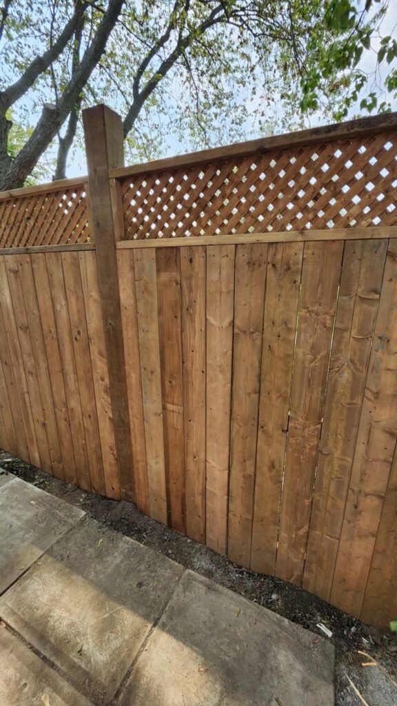 Cedar privacy fence with a lattice top and post